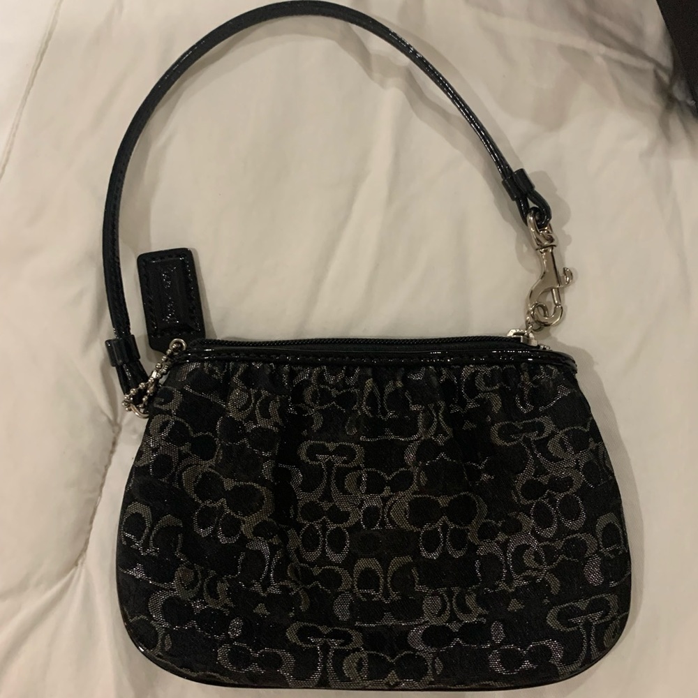 Coach wristlet 6”x4 “ Used Good Condition Some discoloration around inner zipper